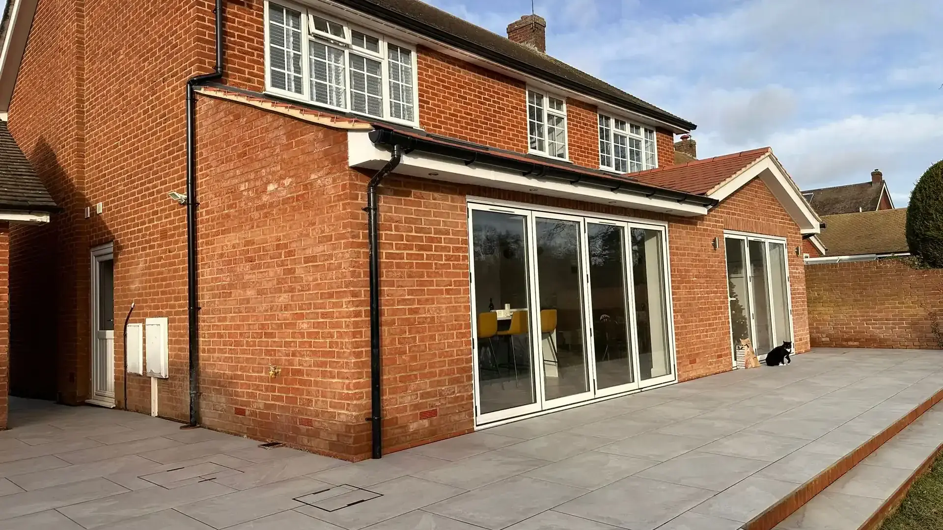 Rear extension with bifold doors and a porcelain patio